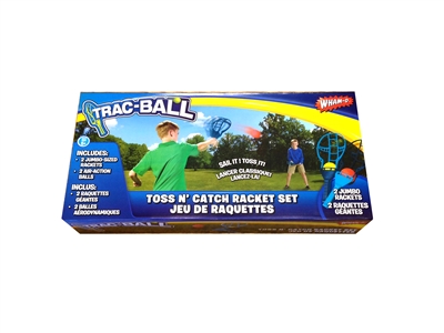Wham-O Trac Ball package with two kids playing with the trac ball set. The kid in green is launching a trac ball towards the kid in blue. On package includes a picture of all contents in set. Two Trac Ball racquets & two trac balls.